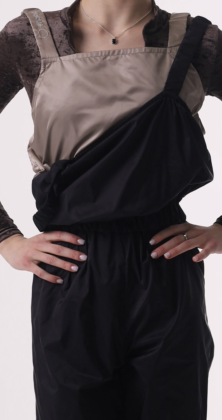 Girl wearing a black sauna overalls by Dancelab
