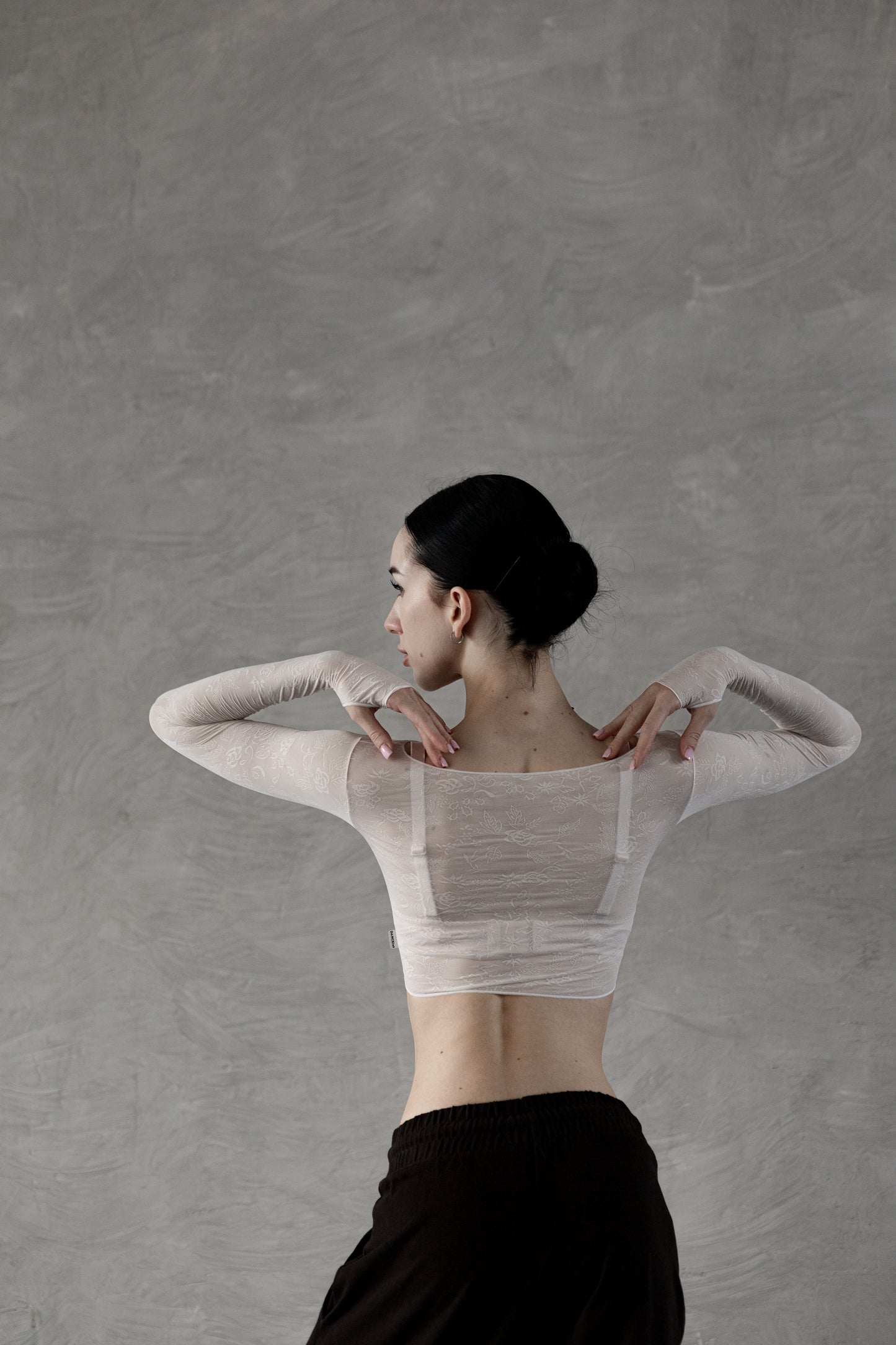 Dancer wearing a white Dancelab crop top