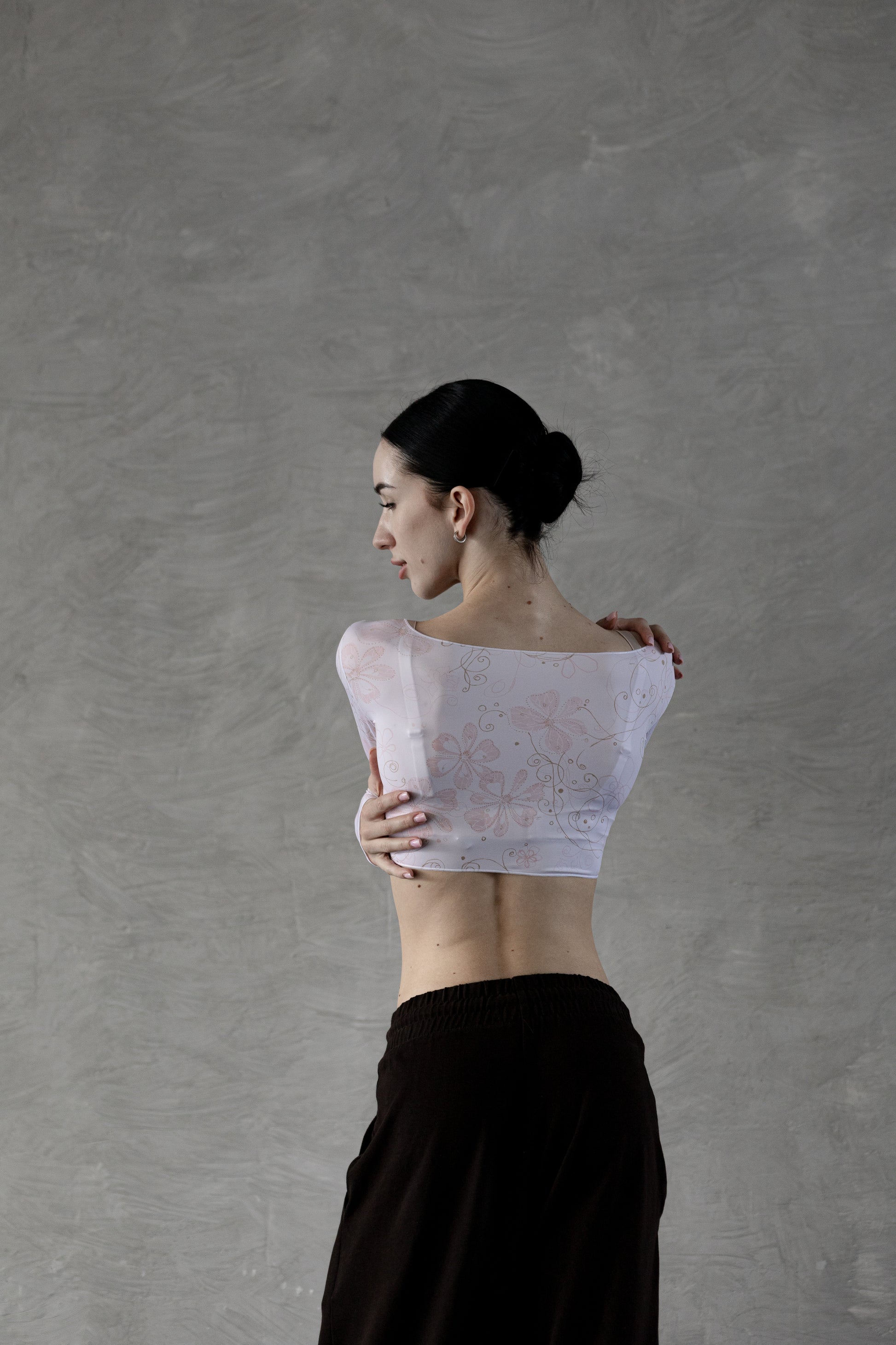 Dancer wearing a powder flower crop top