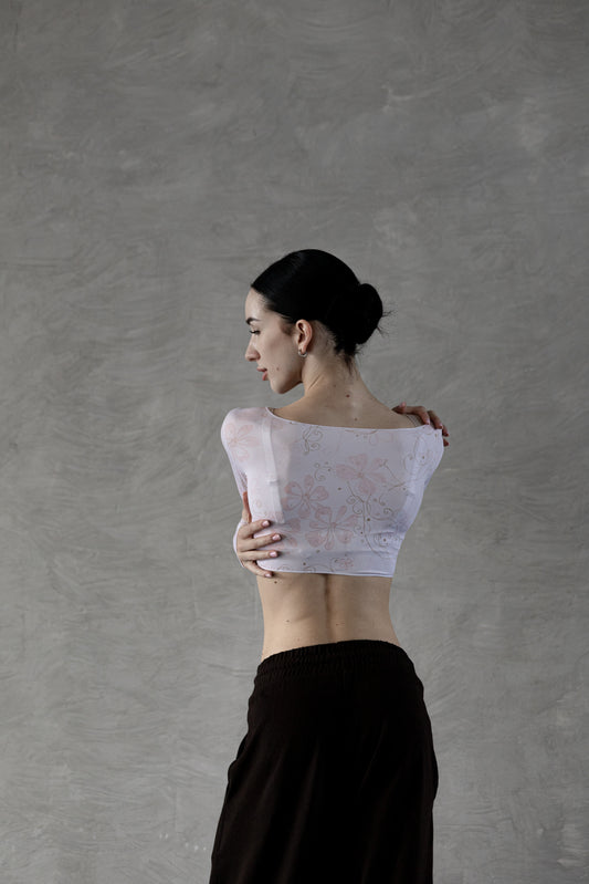 Dancer wearing a powder flower crop top