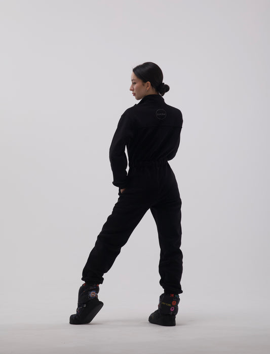 Ballerina posing in fleece overalls by Dancelab