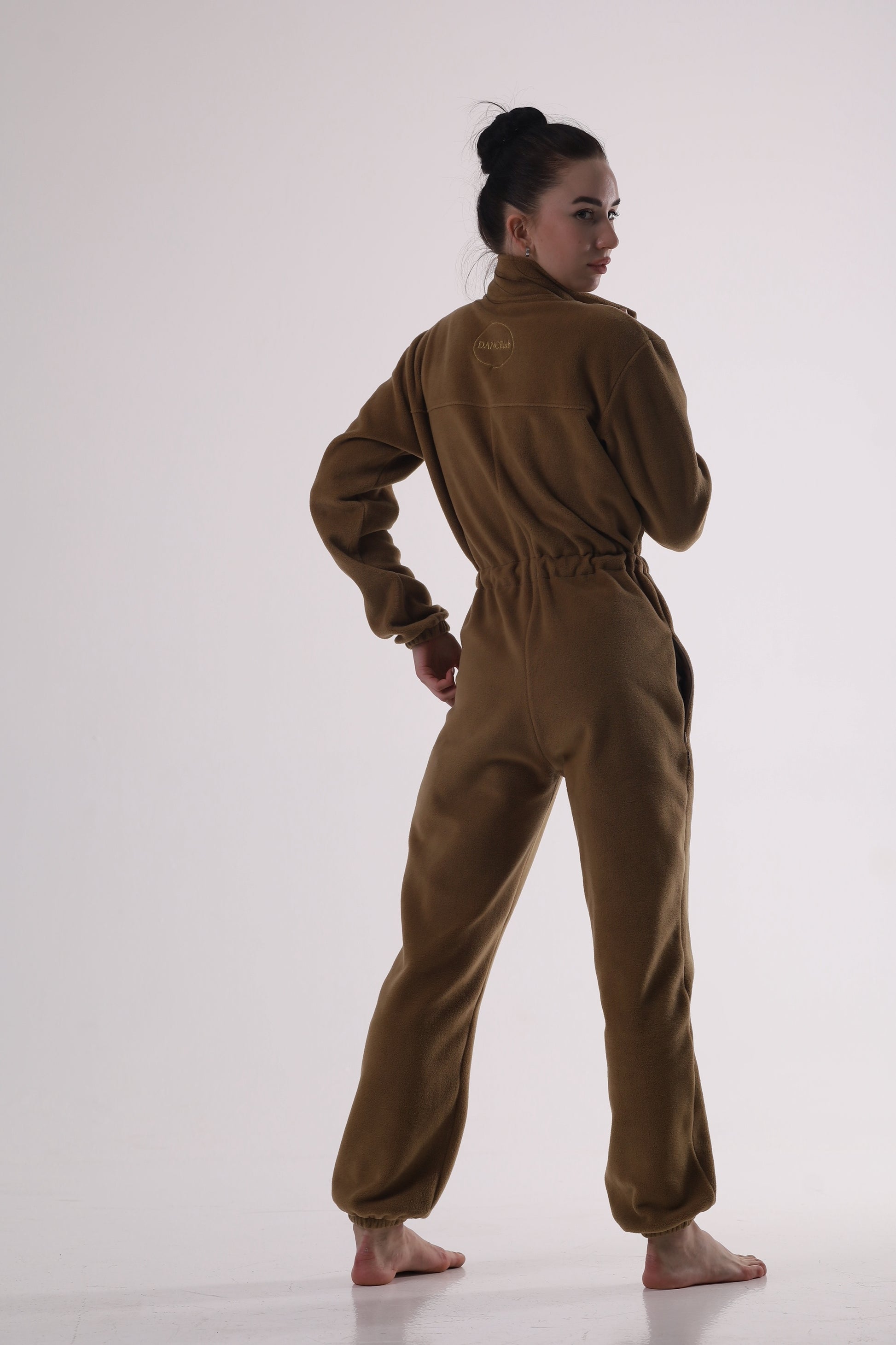 Person wearing a send color jumpsuit by Dancelab