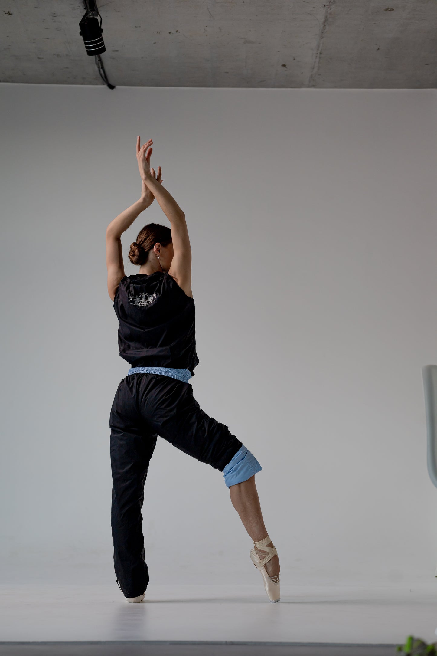 Dancer wearing Dancelab warm-up pants 2 sides
