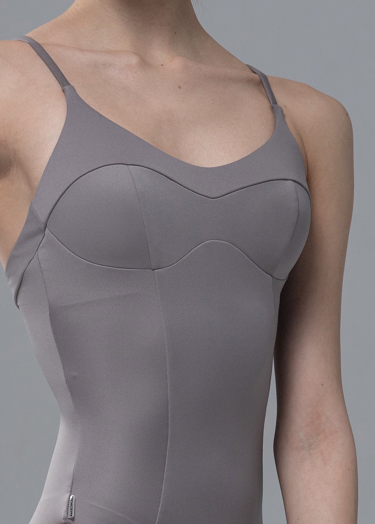 Dancelab gray ballet leotard worn by a girl on a gray background