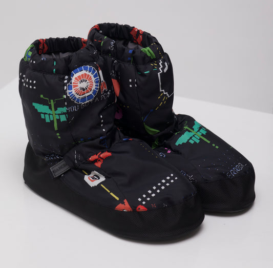 Pair of Dancelab black ballet warm up booties with colorful patterns on a white background