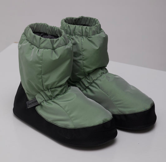 Pair of Dancelab green ballet warm up booties with black soles on a white surface